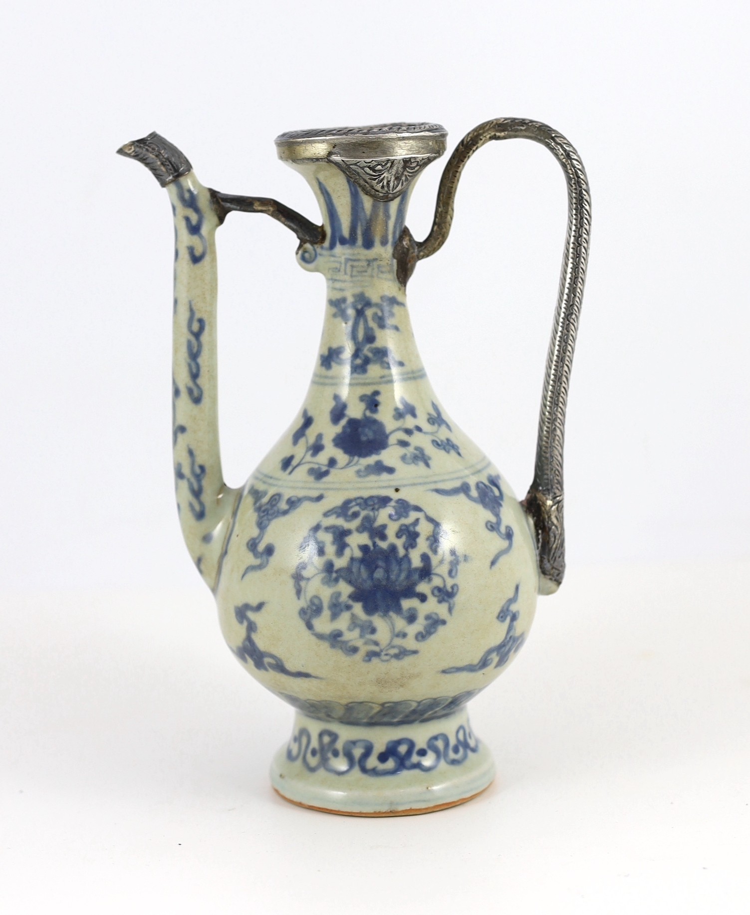 A Chinese late Ming blue and white ewer, made for the Islamic market, Jiajing to Wanli period, 21cm high, damage and later Islamic silver mounts